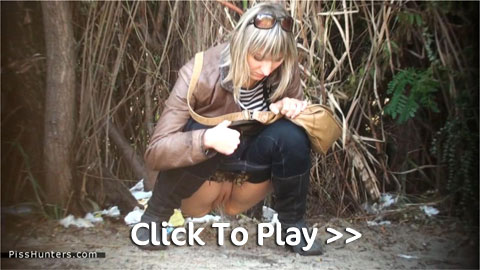Blond with shaved pussy pissing in the dirt