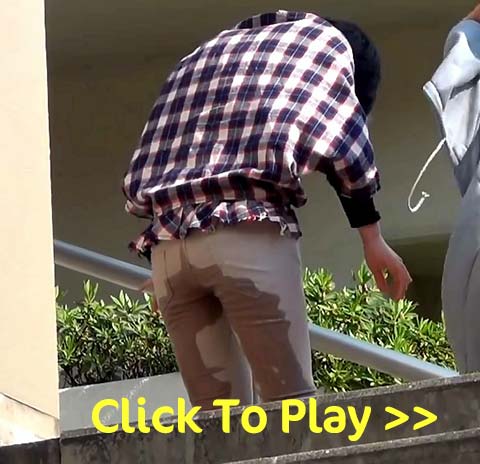 Pissing in brown pants outdoors