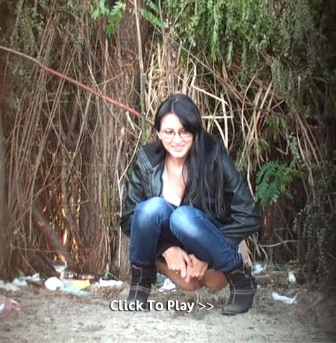Chick with glasses peeing in the dirt